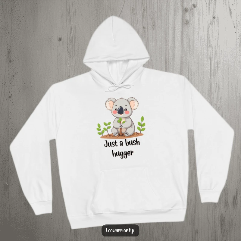 Funny Koala planting a tiny tree with gentle hands, looking cheerful on a cozy hoodie, a great gift for nature lovers.