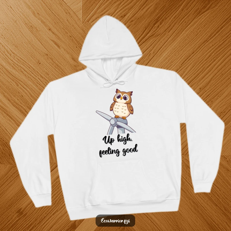 Funny hoodie with a delighted owl perched on a wind turbine, looking upwards, embodying peace and environmental awareness.