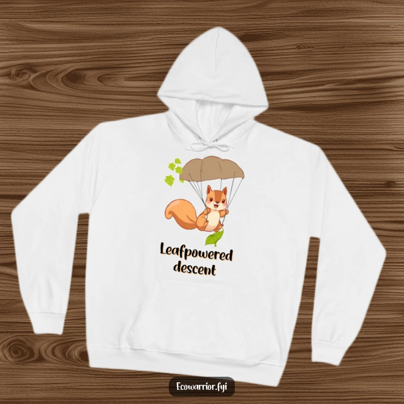 Funny Squirrel Hoodie featuring a brave squirrel using a fallen leaf as a parachute, ready for any descent.